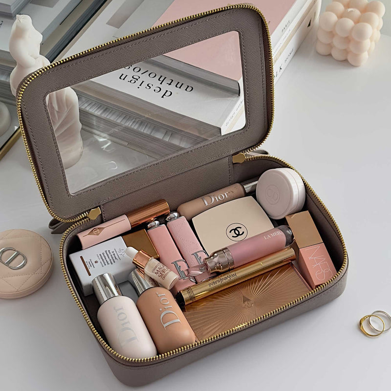 Truffle Clarity Jetset Large in Toffee filled with beauty items.