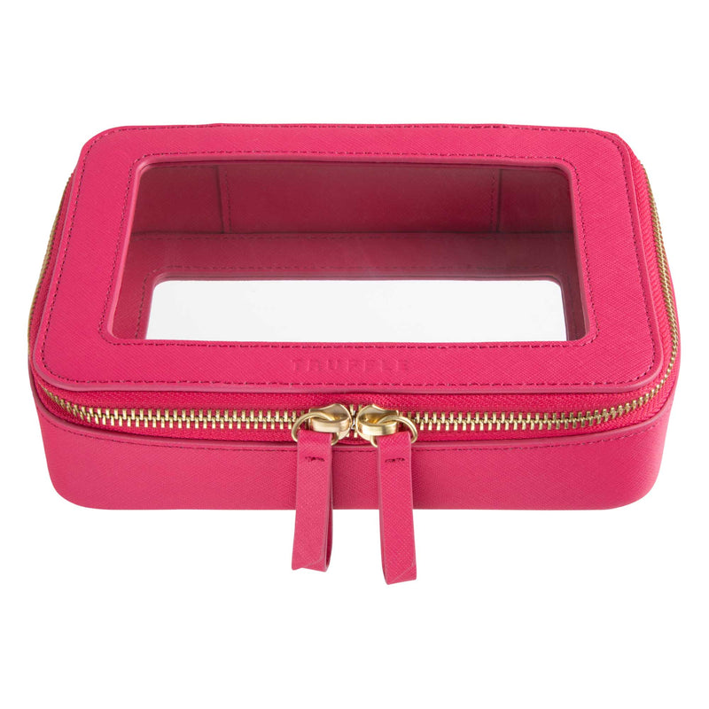 Truffle Clarity Jetset Case in hot pink leather, TSA approved for travel-sized liquids. Multipurpose for tech or makeup organization.