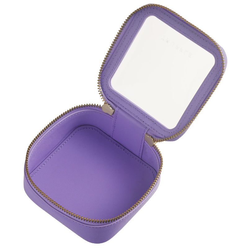 Open view of a Truffle Clarity Petite Case trimmed in lilac leather, perfect for small essentials.