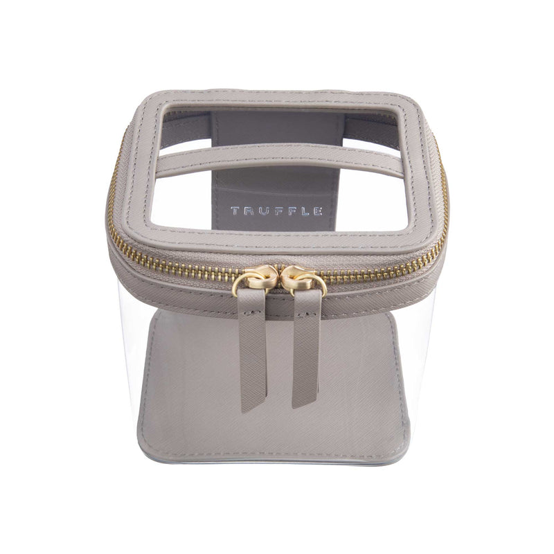 Truffle Clarity Mini Train Case, trimmed in Toffee leather, perfect for small beauty, tech and everyday essentials.toffee-leather