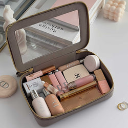 Truffle Clarity Jetset Large in Toffee filled with beauty items.