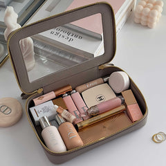 Truffle Clarity Jetset Large in Toffee filled with beauty items.