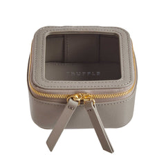 Truffle Clarity Petite Case trimmed in  toffee leather, perfect for small essentials.