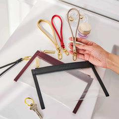 Truffle Wristlet Straps, in various colors, shown with Clarity Clutch Minis.