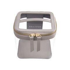 Truffle Clarity Mini Train Case, trimmed in Toffee leather, perfect for small beauty, tech and everyday essentials.toffee-leather