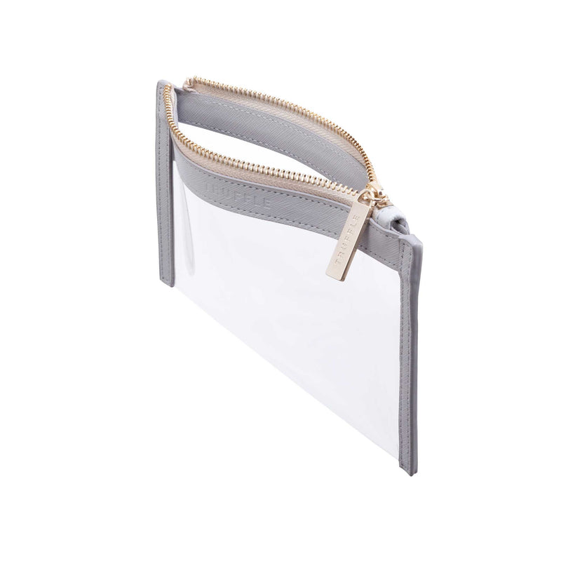 Side view of a Truffle Clarity Clutch Mini, a sleek zippered pouch with clear TPU plastic and Dove Grey leather trim.
