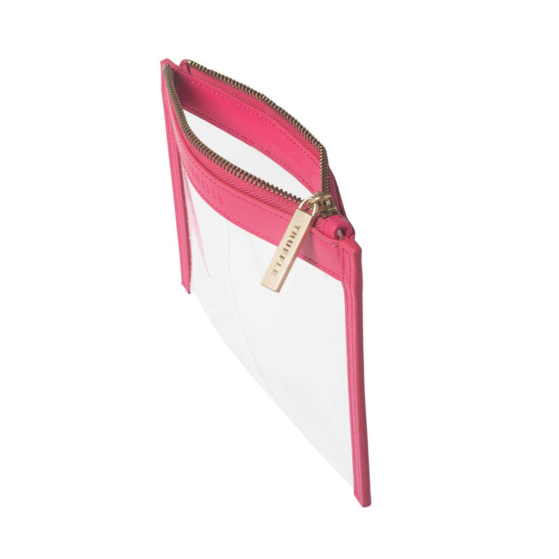 Side view of a Truffle Clarity Clutch Mini, a sleek zippered pouch with clear TPU plastic and Hot Pink leather trim.