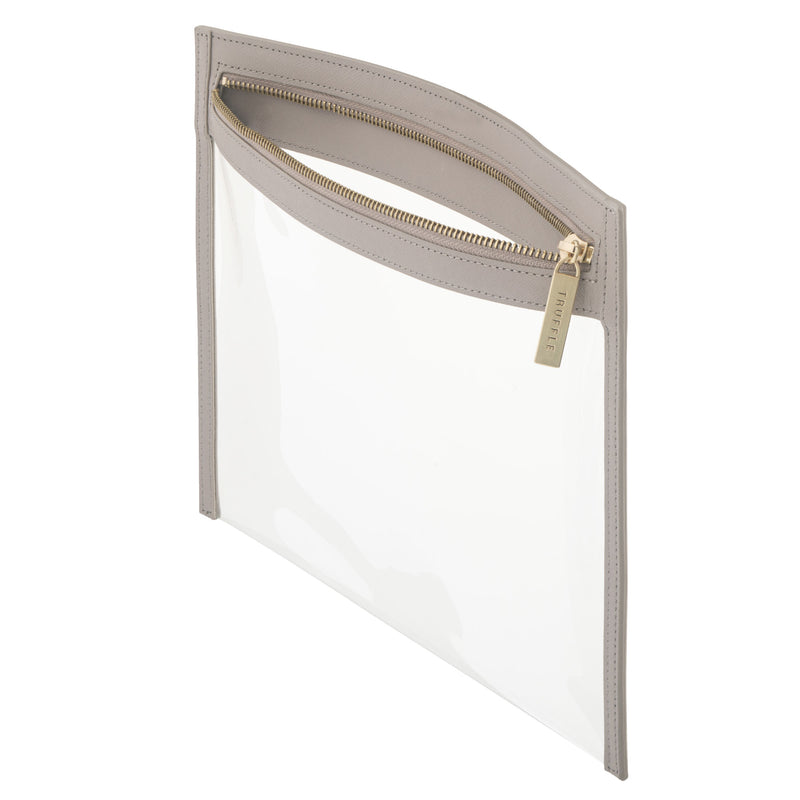 Side view of a Truffle Clarity Clutch Large with a clear TPU body and solid Toffee colored leather trim, featuring a gold zipper.