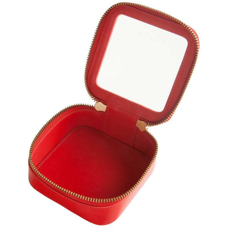 Open view of a Truffle Clarity Petite Case trimmed in red leather, perfect for small essentials.